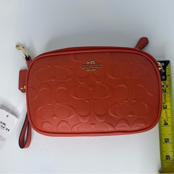 Coach camera bag with signature coated canvas detail. Shoulder/wrist strap.Coral - Picture 7 of 8